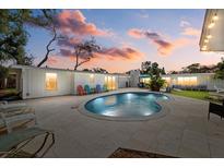 Inviting pool and patio area, perfect for outdoor entertaining at 2069 Bougainvillea St, Sarasota, FL 34239