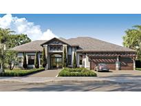 Luxury home with three-car garage and attractive landscaping at 4644 Higel Ave, Sarasota, FL 34242