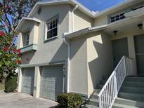 Two-story condo with attached garage and landscaping at 5405 Fair Oaks St # 5405, Bradenton, FL 34203