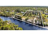 Aerial view showing property boundaries, riverfront access, and lush landscaping at 1285 & 1289 Hagle Park Rd, Bradenton, FL 34212