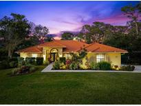 Beautiful one-story home with tile roof and landscaped yard at 3901 Balsam Ct, Sarasota, FL 34243