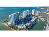 Aerial view of waterfront property with luxurious high-rise condos and marina at 988 Blvd Of The Arts # 915, Sarasota, FL 34236