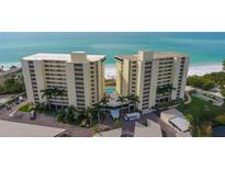 Oceanfront condo building with pool and recreational areas at 19 Whispering Sands Dr # 1204, Sarasota, FL 34242