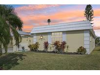 Well-maintained Ranch style home with landscaped yard and sunset view at 5891 Tidewood Ave # 1, Sarasota, FL 34231