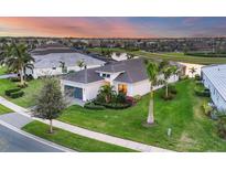 Aerial view of a house and neighborhood at sunset at 4939 Surfside Cir, Bradenton, FL 34211