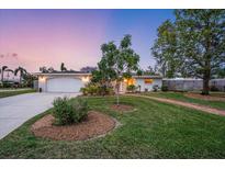 Beautiful home with a landscaped yard and brick pathway at 1854 Cockleshell Dr, Sarasota, FL 34231