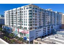 Modern high-rise building with city views and unique mural at 111 S Pineapple Ave # 1102, Sarasota, FL 34236