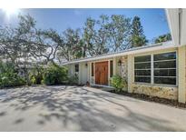 Attractive ranch home with double doors and nicely landscaped yard at 640 Venice Ln, Sarasota, FL 34242
