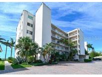 Side view of the building showcasing its architecture at 4825 Gulf Of Mexico Dr # 304, Longboat Key, FL 34228