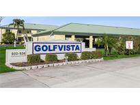 Golfvista community entrance sign with landscaping and paved road at 932 Capri Isles Blvd # 216, Venice, FL 34292