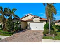 Attractive single-story home with a paved driveway and landscaping at 1035 Bradberry Dr, Nokomis, FL 34275