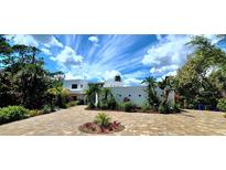 Stunning contemporary home with landscaped grounds and a paved driveway at 269 Pine Ranch Trl, Osprey, FL 34229