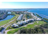Luxury waterfront home with golf course views and private pool at 3408 Fair Oaks Ln, Longboat Key, FL 34228