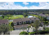 Aerial view of condo community near golf course and lake at 5330 Hyland Hills Ave # 2311, Sarasota, FL 34241