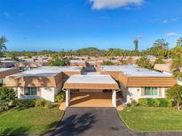 Aerial view of a community of villas with lush landscaping at 2505 Riverbluff Pkwy # V196, Sarasota, FL 34231