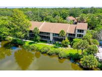 Aerial view of condo community showing building location and surrounding landscape at 5369 Lake Arrowhead Trl # 17A, Sarasota, FL 34231