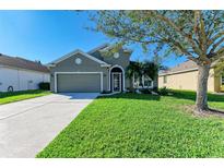 Attractive one-story home with a well-manicured lawn at 7825 112Th E Ave, Parrish, FL 34219