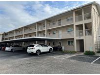 Two-story condo building with covered parking and ample space at 3983 Maceachen Blvd # 432, Sarasota, FL 34233