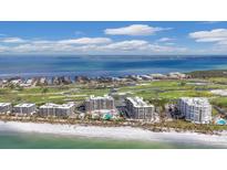Aerial view of luxury beachfront condos with ocean and golf course views at 545 Sanctuary Dr # A803, Longboat Key, FL 34228