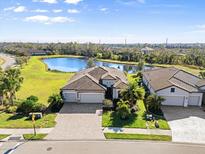 Luxury home with 3-car garage, situated on a spacious lot near a pond at 6503 Rosehill Farm Run, Bradenton, FL 34211