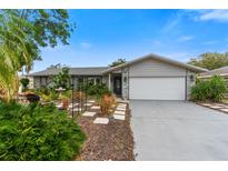 Charming single-story home with landscaped yard and attached garage at 6706 22Nd W Ave, Bradenton, FL 34209