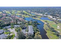 Aerial view of condo community near golf course and lake at 7130 Fairway Bend Ln # 193, Sarasota, FL 34243