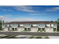 Modern townhome community with attached garages and neutral color palette at 15104 Cuzcorro Ct, Nokomis, FL 34275