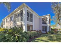 Well-maintained condo building with lush landscaping at 5697 Sheffield Greene Cir # 51, Sarasota, FL 34235