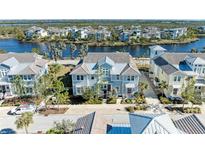 Aerial view of waterfront community with luxury homes at 311 Compass Point Dr # 201, Bradenton, FL 34209