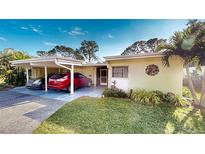 Updated condo with carport parking and tropical landscaping at 3522 Silver Pine Ct # 90, Sarasota, FL 34231
