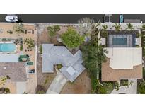 Aerial view of single-Gathering home with pool and canal access at 5402 Shadow Lawn Dr, Sarasota, FL 34242