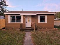Cute brown house with white trim and well-maintained lawn at 739 52Nd N Ave, St Petersburg, FL 33703