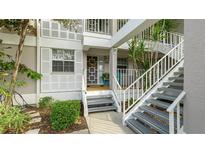 Inviting condo entrance with stairs and landscaping at 1109 Edgewater Cir # 1109, Bradenton, FL 34209