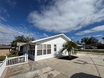 White single-story house with a palm tree and driveway at 3517 Bahia Vista St, Sarasota, FL 34239