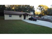 Single story home with a carport and spacious yard at 219 E Early St, Brooksville, FL 34601