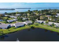 Aerial view of waterfront community, showcasing home and landscape at 4511 Lexington Cir, Bradenton, FL 34210
