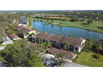 Aerial view of condo community near a lake and golf course at 5261 Mahogany Run Ave # 624, Sarasota, FL 34241