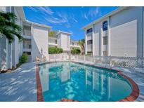 Refreshing community pool with brick coping and surrounding patio at 6304 Pointe West Blvd # A306, Bradenton, FL 34209