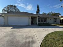 Single story home with attached garage and driveway at 732 Tuxford Dr, Sarasota, FL 34232