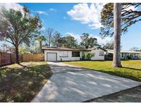 Cute bungalow with a large driveway and fenced yard at 2586 Tami Sola St, Sarasota, FL 34237
