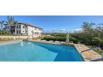 Inviting pool area with expansive patio and gorgeous water views at 3858 Casey Key, Nokomis, FL 34275