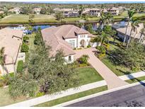 Luxury waterfront home with tile roof and paver driveway; enjoy amazing water views! at 11740 Rive Isle Run, Parrish, FL 34219