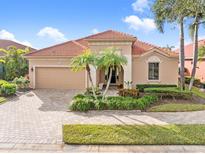 Attractive single-story home with a tile roof and landscaped front yard at 5133 Cantabria Crst, Sarasota, FL 34238