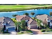 Luxury homes with tile roofs and golf course views at 13947 Messina Loop, Bradenton, FL 34211