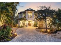 Two-story home with a paved driveway and landscaping at 1718 Prospect St, Sarasota, FL 34239