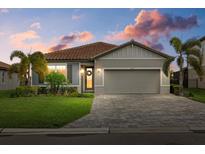 Attractive one-story home with a two-car garage and landscaping at 3713 Savanna Palms Ct, Bradenton, FL 34211