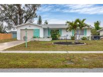 Charming ranch home with landscaped yard and attached garage at 6045 Slade Rd, North Port, FL 34287