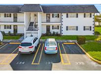 Condo building with parking and landscaping at 202 47Th Avenue W Dr # 334, Bradenton, FL 34207