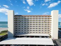 Oceanfront building, featuring multiple floors and balconies, offering stunning ocean views at 255 The Esplanade N # 506, Venice, FL 34285