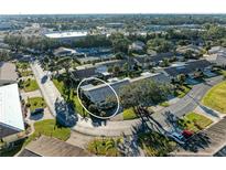 Aerial view of a condo community showing a single-story home with surrounding landscape at 390 301 W Blvd # 11D, Bradenton, FL 34205